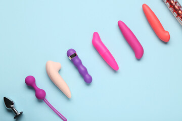 Composition with different sex toys on blue background