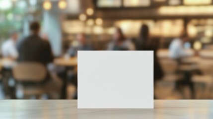 Fototapeta premium Elegant Business Card Mockup in Modern Coffee Shop Ambiance with Blurred Patrons - Lifestyle Element for Professionals