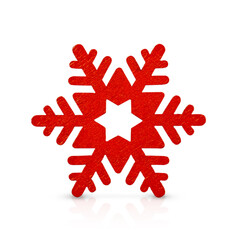 A red snowflake is isolated on a white background.