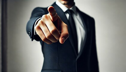 Businessperson pointing forward with confident gesture