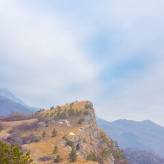 Fototapeta premium mountain ridge under a blue cloudy sky
