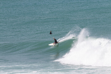 Surfer perfoming a backend turn in VVF, Anse l'etang, tartane, Martinique, West Indies, France