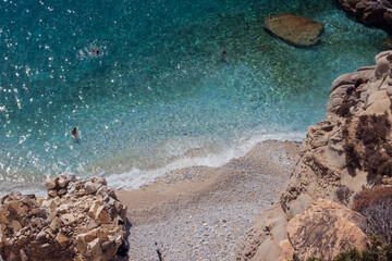 Clear blue aquamarine water texture, mediterranean sea beach, Seychelles beach, Ikaria Island