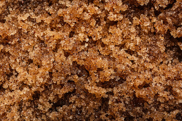 Brown body scrub as background, closeup