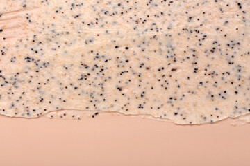Sample of body scrub on beige background, closeup