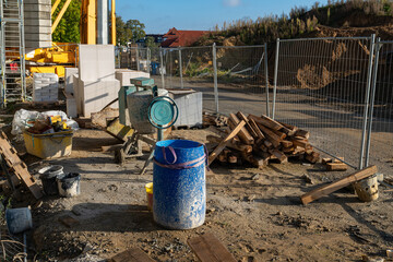 Construction site with equipment and materials in daylight afternoon