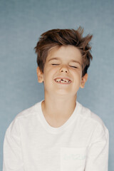 Portret of a smiling boy missing his teeth 
