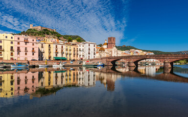 Beautiful view of the picturesque town of Bosa with its colorful houses reflected in the Temo...