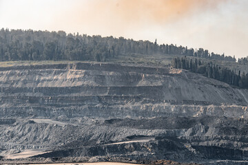 Geological section of soil, layers of coal and rock. Overburden open mine anthracite. Dark texture...