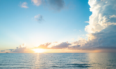 Sunrise sea. Calm sea with sunset sky through the clouds over. Meditation ocean and sky background. Tranquil seascape. Horizon over the sunset sea water. Calm sea with sunset sky.