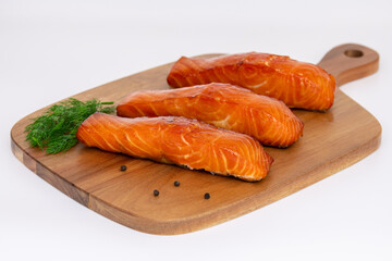 Deliciously Grilled Salmon Fillets Arranged Beautifully on a Rustic Wooden Board