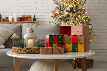Christmas Advent calendar with lantern on table in living room, closeup