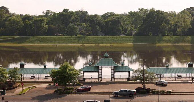 Afternoon sun shines on the Ouachita River boardwalk in downtown Monroe, Louisiana, USA.