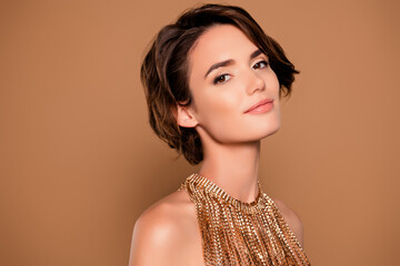 Photo of attractive girl celebrity wear shiny golden necklace isolated beige color background