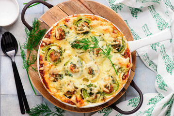 Baked zucchini rolls with minced meat, egg and cheese..selective focus
