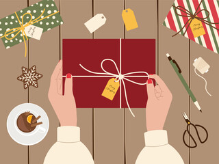 Christmas preparation concept featuring gift wrapping from top view with hands. Vector background for festive designs, holiday packaging, and seasonal promotional content