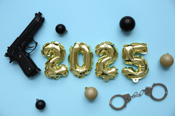 Figure 2025 with police officer's items and Christmas balls on blue background