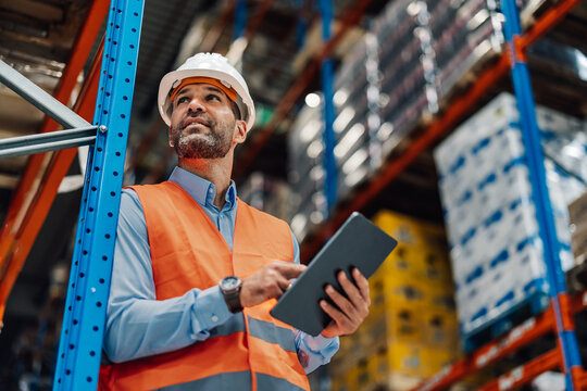 Warehouse manager using digital tablet and controlling inventory