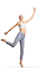 Tall slim woman in jeans and white crop top dancing