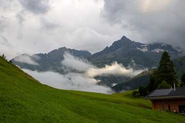 Swiss alpine village and meadows in the mountains