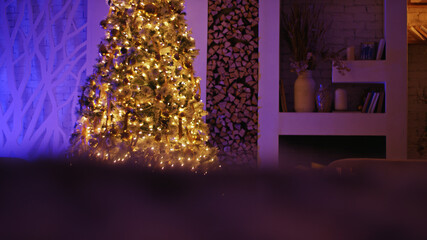 Cozy room with a festive christmas tree glowing with lights and ornaments, creating a magical holiday atmosphere