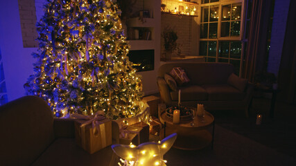 Beautifully decorated christmas tree is illuminating a cozy living room at night, creating a warm and inviting atmosphere for the holiday season