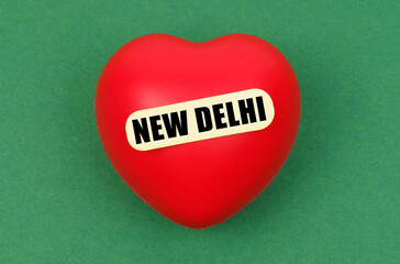 A vibrant red heart symbolizes affection for New Delhi, the bustling capital city, evoking warmth and love in a playful and artistic manner