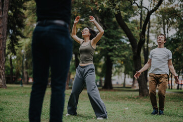 A group of students participates in an engaging outdoor sports class with their instructor, surrounded by lush greenery in the park, promoting fitness and teamwork.