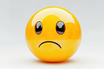 Fototapeta premium Sad face emoji in vibrant yellow against a clean white background.