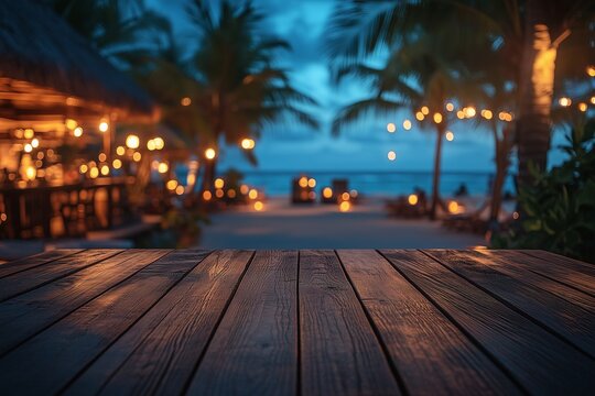 Empty wooden table with blurred luxury beach club at night