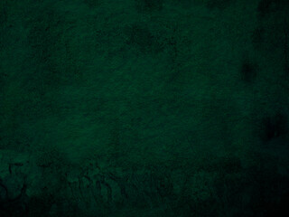 Dark emerald green watercolor texture with irregular stains.