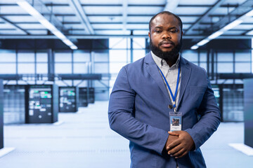 Engineer in server room implementing and maintaining security measures to protect data and systems from unauthorized access or cyber threats. Data center employee doing hardware installation