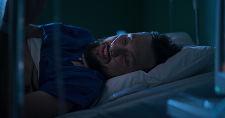 Man sharing updates about his health condition with family on the phone from hospital.