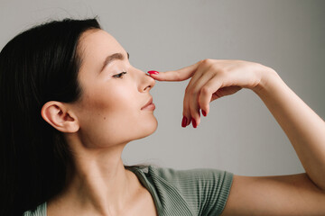 Rhinoplasty and septoplasty. Young girl is suffering from deviated nasal septum. Healing breathing...