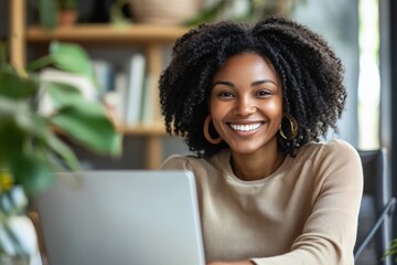 Happy African American woman engaged in a virtual team meeting while working remotely in a cozy, inclusive workspace