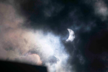 Obraz premium Solar eclipse covered by clouds , in Argentina