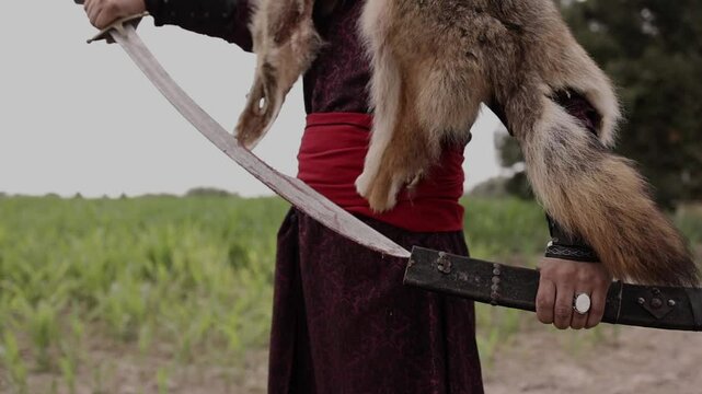 A Mongolian warrior shows off his beautiful sword