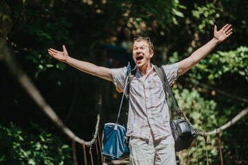 A joyful man celebrates on a suspension bridge, embracing the thrill of nature and adventure in the...