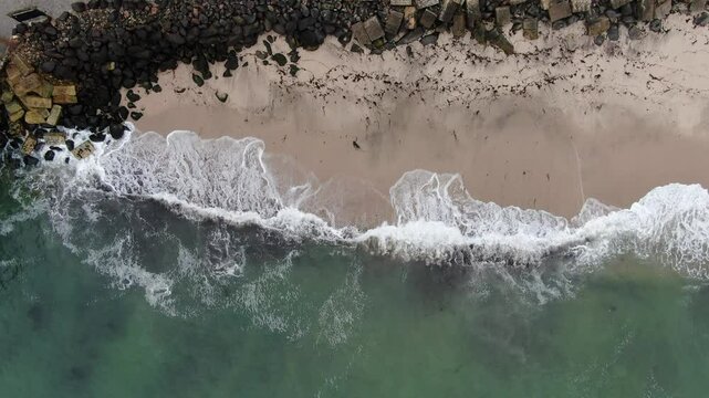 Gentle ocean waves hitting the beach in Namibia