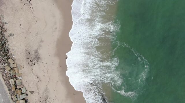 Gentle ocean waves hitting the beach in Namibia