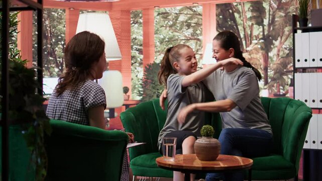 Loving mother accepting her daughter as she is at therapy session, expressing her unconditional love and tenderness. Mom and adolescent bonding together in counseling, acceptance. Camera B.