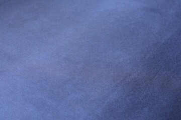 Texture of dark blue silk fabric as background, closeup