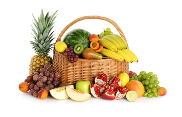 Many different fresh fruits in wicker basket isolated on white
