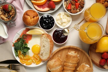 Different tasty food served for brunch on white wooden table, flat lay