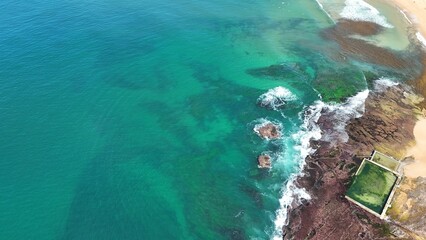 Aerial view drone shot of a beach with clear water  © Peakview Photography