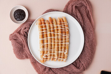 Cheese roll is a street food Indonesia, made from cheese wrapped in pastry skin and then fried. on a beige background. top view