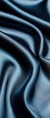 Obraz premium Satin fabric texture, deep blue with soft folds, white isolated background