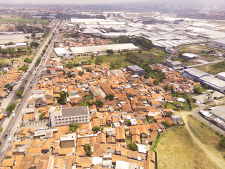 Fototapeta premium Aerial view of Multiple lane highways, Rancaekek. Main road transportation in industrial city zone from drone view. Background texture concept. Business and Economy