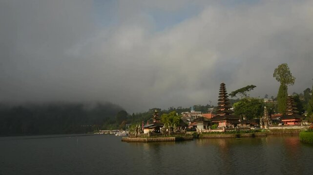 Pura Ulu Danau Temple Bali travel Indonesia Destination Exotic Place of worship in Silhouette. Lake temple Indonesian Culture Tranquil Scene Idyllic Tourism Balinese Hinduism Pagoda Beauty In Nature