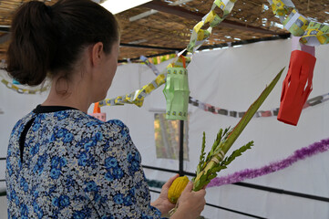 Jewish woman blessing on the four species on the Jewish holiday of Sukkot